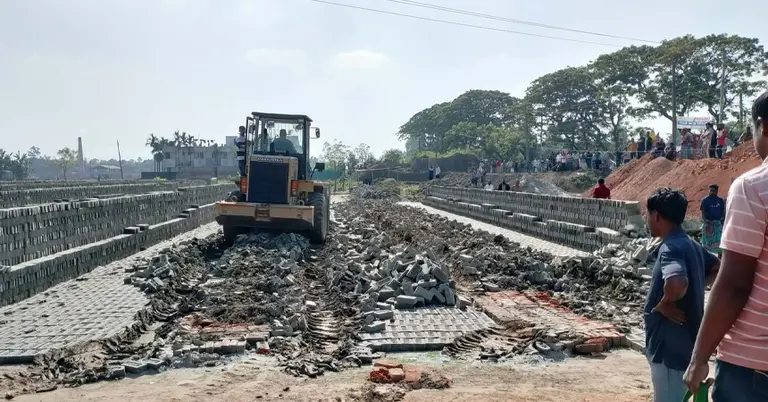 ইটভাটার তৈরি করা কাঁচা ইট ভেঙে দেয়া হচ্ছে